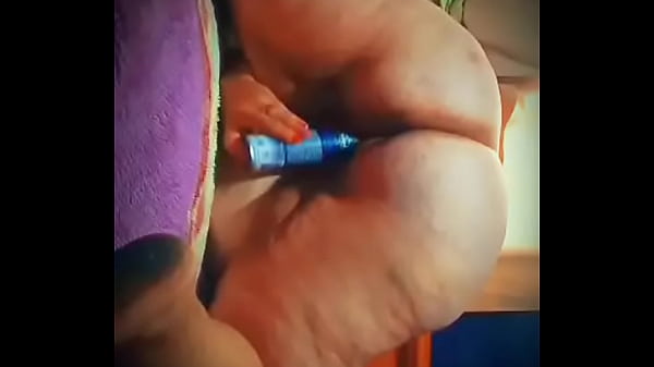 Mature lady masturbating with deodorant on all four