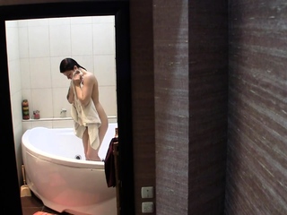 Stunning brunette getting of the shower naked